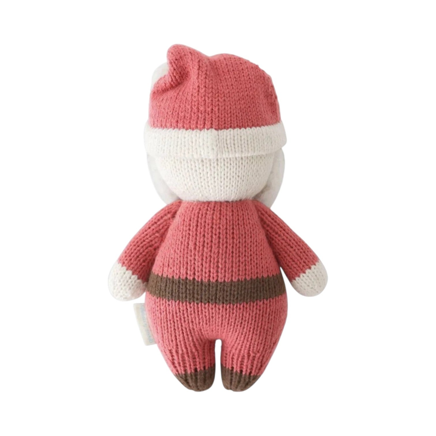The Baby Santa knitted plush toy by Cuddle + Kind is shown from the back, dressed in a red and white outfit with a hat, against a plain white background.