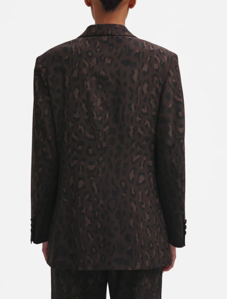 Person wearing the Blaze Milano Simba Daisy Blazer, featuring a dark leopard print, shown from the back against a plain white background.
