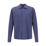 The Herno Seersucker Shirt Jacket is a long-sleeved, button-up style crafted in solid blue, featuring two chest pockets. Shown against a plain white background, this lightweight and versatile piece is ideal for effortless layering.