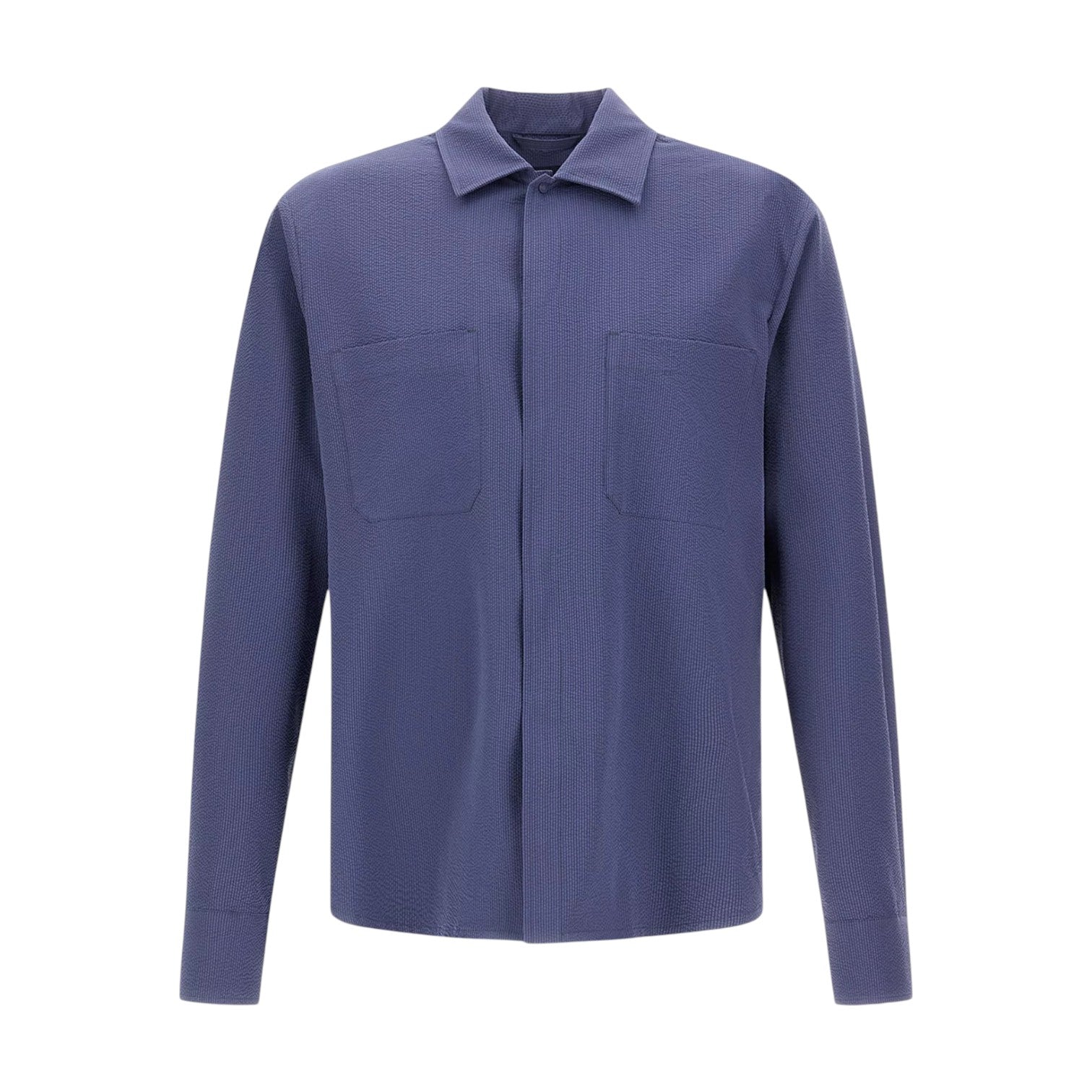 The Herno Seersucker Shirt Jacket is a long-sleeved, button-up style crafted in solid blue, featuring two chest pockets. Shown against a plain white background, this lightweight and versatile piece is ideal for effortless layering.