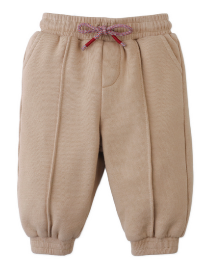 Gingersnaps Baby Boys’ Fiulio Joggers in beige feature cozy pintuck details, an elastic waistband with a multicolored drawstring, side pockets, and ribbed cuffs.