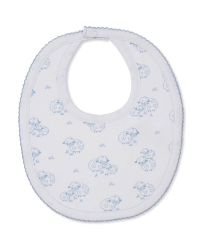 The Sweet Sheep Bib by Kissy Kissy features an oval shape with scalloped edges, a snap closure at the neck, and a charming blue sheep pattern on white. Made from the softest Pima cotton, it provides ultimate comfort for your baby's delicate skin.