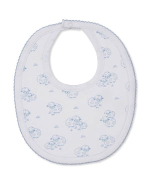 The Sweet Sheep Bib by Kissy Kissy features an oval shape with scalloped edges, a snap closure at the neck, and a charming blue sheep pattern on white. Made from the softest Pima cotton, it provides ultimate comfort for your baby's delicate skin.