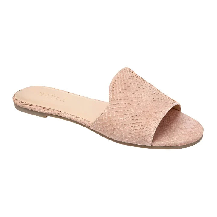 The Nayla Josefina Sandal by Nayla is a pink, textured, open-toe flat sandal featuring a single wide strap and a flat sole crafted from sustainable materials.