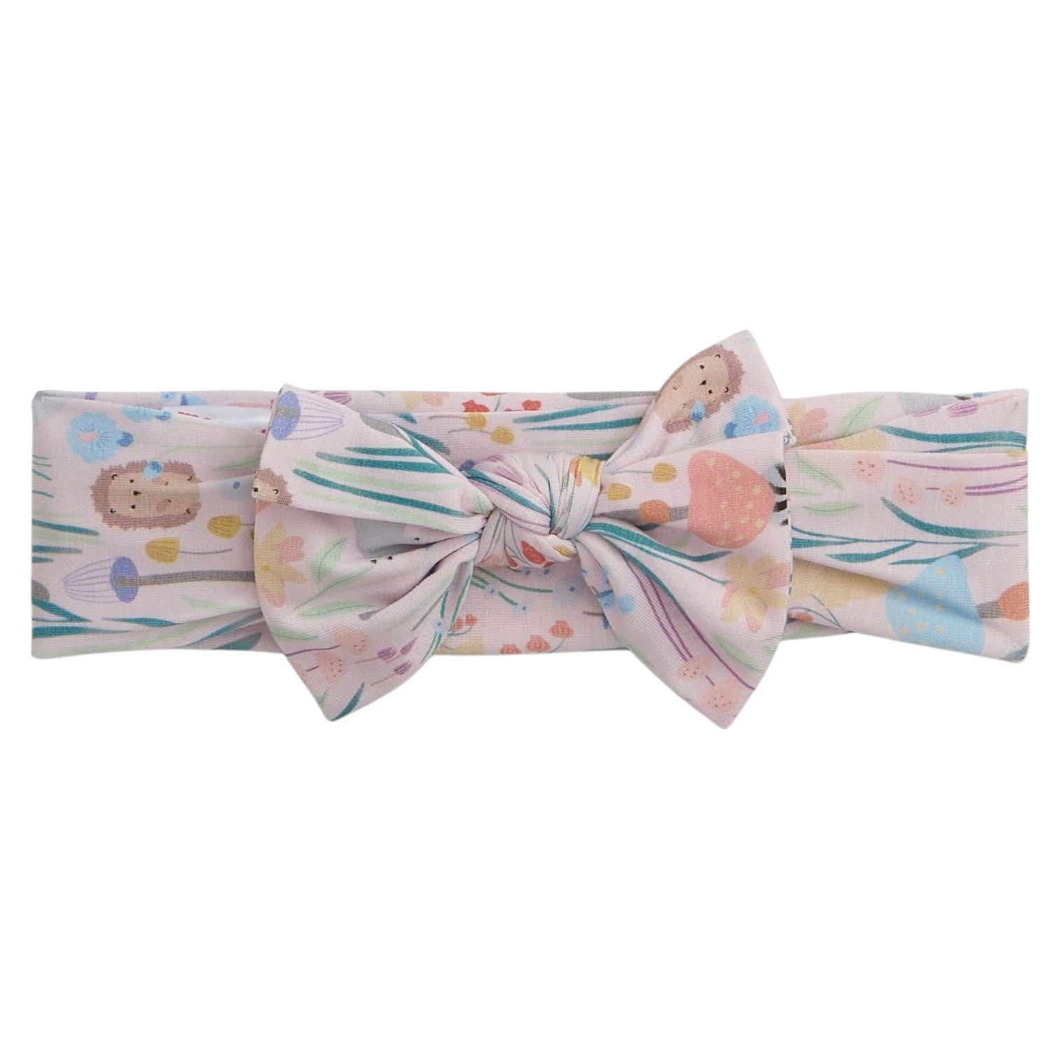 The Magnetic Me Baby Girls' Shroom and Bloom Modal Headband is a soft TENCEL™ modal accessory with a large bow, featuring pastel woodland animals and floral prints on a light background.
