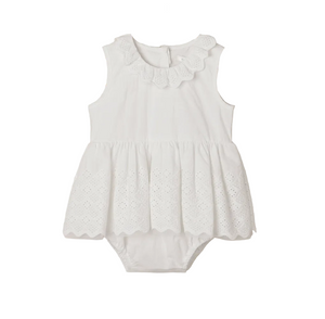 The Noralee Baby Girls’ Georgia Romper features a white sleeveless design with a scalloped collar and delicate eyelet detailing on the skirt, thoughtfully crafted for easy changing and presented against a plain white background.