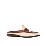 The Simkhai Dean Canvas Como Loafer Mule is a beige and brown backless slip-on loafer, crafted with a stitched leather upper and set on a low black sole, displayed against a white background.