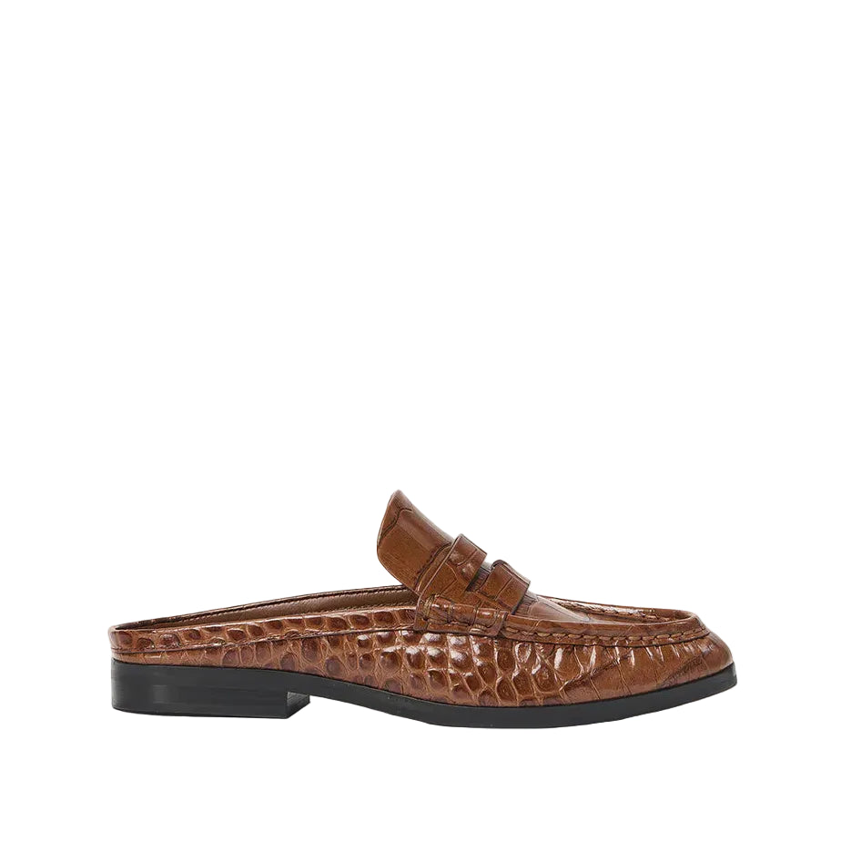 Simkhai's Dean Leather Loafer Mule in brown croc-embossed leather features a black sole and low heel, displayed in profile against a white background.