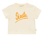 The Baby Siesta T-Shirt by Arsene & Les Pipelettes is a cream-colored, short-sleeved cotton tee featuring a breathable design and bold orange "Siesta" script printed across the chest.