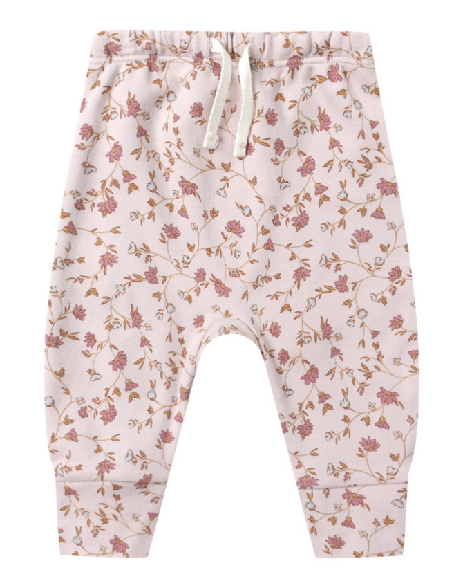 The Quincy Mae Baby Drawstring Pant is crafted from organic brushed jersey in light pink, featuring an elastic waistband and an all-over floral print in shades of pink and brown.