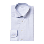 A Contemporary Geometric Print Poplin Shirt by Eton, featuring a spread collar and buttoned cuffs, with a subtle geometric pattern and expertly folded on a white background—a versatile wardrobe staple.