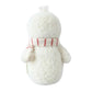 The Cuddle + Kind Baby Snowman - Candy Cane, handcrafted from cotton yarn, faces away while wearing a white scarf with red stripes against a plain white background.
