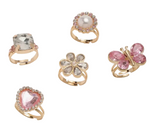 The Super Smalls Heartfelt Sparkle Ring Set includes five gold rings with a square clear stone, round pearl, flower, pink butterfly, and pink heart-shaped gem—ideal for Valentine’s Day or dress-up fun.