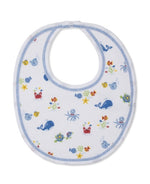 The Kissy Kissy Ocean Antics Printed Bib is crafted from the softest cotton for ultimate comfort. This white baby bib features blue trim and colorful sea animal illustrations, including whales, crabs, octopuses, turtles, and starfish.