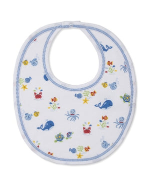 The Kissy Kissy Ocean Antics Printed Bib is crafted from the softest cotton for ultimate comfort. This white baby bib features blue trim and colorful sea animal illustrations, including whales, crabs, octopuses, turtles, and starfish.
