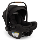 The Nuna Pipa Aire RX Carseat in black features a canopy, handle, safety harness, smart security technology, and instructional labels on the side.