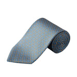 A Geometric Printed Silk Tie by Eton, elegantly rolled and displayed on a white background, showcases a refined blue silk accented with repeating gold and light blue geometric motifs—an essential accessory for business sophistication.