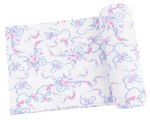 The Angel Dear Swaddle Blanket features white ribbed fabric with blue and pink floral and ribbon patterns—perfect for crafting a soft baby blanket or cozy viscose from bamboo swaddle for your little one.