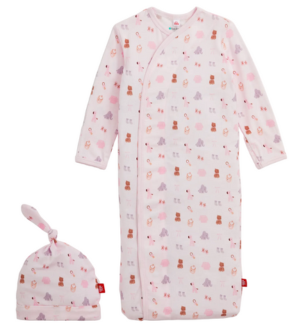 The Magnetic Me Baby Nursery Nostalgia Modal Gown + Hat Set in pink, featuring an adorable animal print, is displayed on a white background—perfect as a cozy and comfortable newborn gown for your little one.