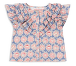 The Konges Slojd Baby Girls’ and Girls Kim Frill Shirt is a short-sleeved blue blouse made from soft organic cotton, adorned with a pink and white floral print, front buttons, and delicate frill detailing on the shoulders and chest.