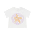 The Stella McCartney Kids Baby Girls' Starfish T-Shirt features a smiling starfish graphic with purple accents and dotted text—perfect as a cute summer or beach shirt.