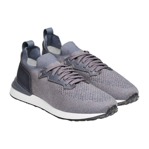 The Magnanni Stratus Sneaker is a gray knit pair with dark laces, cushioned footbeds, white midsoles, and black rubber sport soles, shown on a white background.