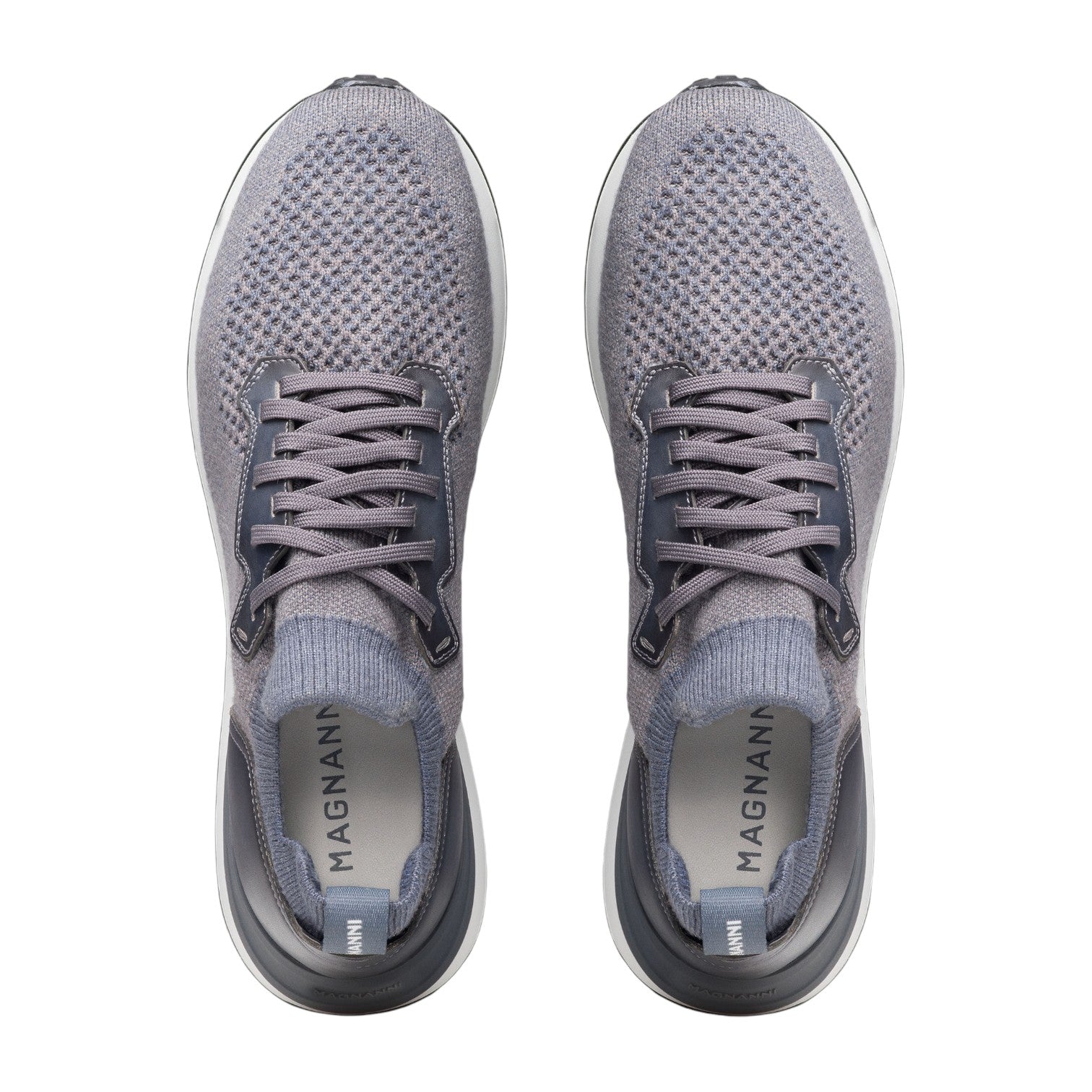 A pair of gray Stratus Sneakers by Magnanni, viewed from above. Featuring laces and cushioned footbeds for lasting comfort, the insoles display the “Magnanni” logo.