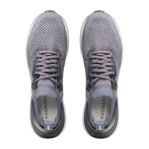 A pair of gray Stratus Sneakers by Magnanni, viewed from above. Featuring laces and cushioned footbeds for lasting comfort, the insoles display the “Magnanni” logo.