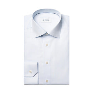 A neatly folded Contemporary Striped Twill Shirt by Eton, crafted from 100% cotton and featuring a classic collar and button cuffs, with the brand name “Eton” on the inner label. This wrinkle-resistant dress shirt is displayed on a white background.
