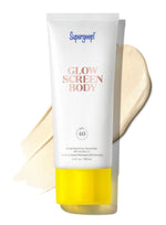 A bottle of Supergoop Glowscreen Body SPF 40 sunscreen, distinguished by its yellow cap, is displayed alongside a smear of its skin-brightening formula.