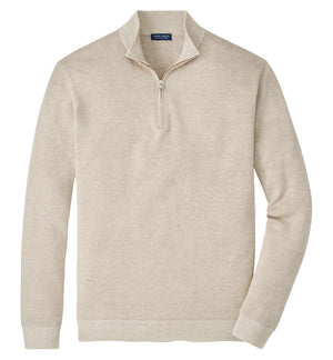 The Barlow Quarter-Zip Sweater by Peter Millar, in beige, features a stand collar and long sleeves, crafted from a Merino-linen-cotton blend with subtle birdseye jacquard knit, shown laid flat on a white background.