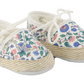 A pair of Tartine et Chocolat Baby Girls’ Liberty Fabric Espadrille Slippers, showcasing a delightful floral pattern in soft Liberty fabric, white laces, and rope-style trim on the soles, displayed on a white background.