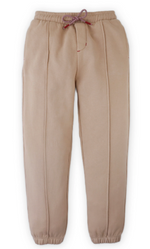 The Boys’ Giulio Jogger Pants by Gingersnaps, shown laid flat on a white background, feature a beige fleece design with an elastic waistband, drawstring, vertical front seams, and elastic cuffs. These comfortable joggers are perfect for everyday wear.