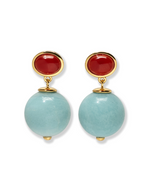 The Umbria Earrings by Lizzie Fortunato showcase gold-plated design with oval red tops and large round light blue amazonite beads suspended below.