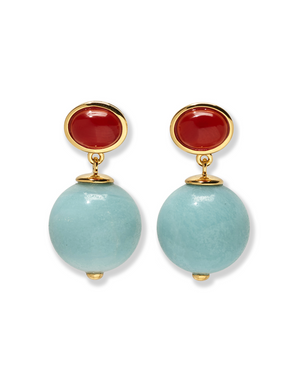 The Umbria Earrings by Lizzie Fortunato showcase gold-plated design with oval red tops and large round light blue amazonite beads suspended below.