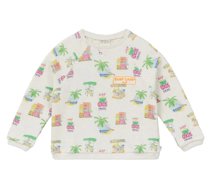 Arsene & Les Pipelettes Boys' and Girls' Mini Coco Sweatshirt—an organic cotton, long-sleeve top for children with a vibrant Surf Camp print of huts, palm trees, and surfboards on a white background.