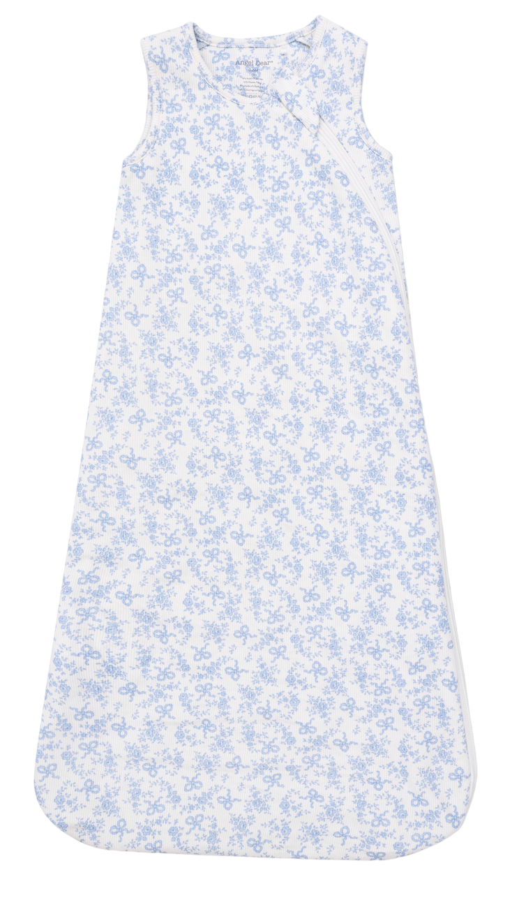 Angel Dear's Baby Sleep Bag features a sleeveless design, blue floral print on white, breathable fabric, diagonal zipper, and rounded bottom edges.