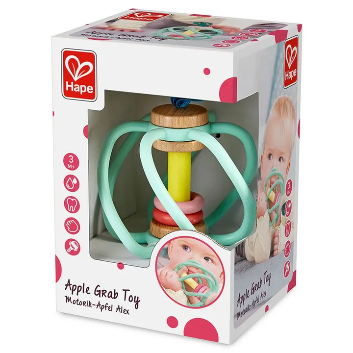 The Hape Apple Grab Toy is a boxed baby toy for ages 3 months+, featuring pastel rings and wooden teether parts, with product info and a baby photo displayed on the packaging.