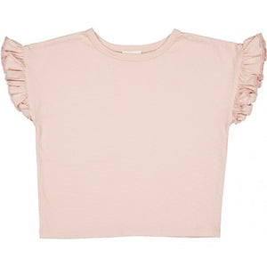 The Louis Louise Girls’ Naomie T-Shirt is a light pink jersey tee with ruffled short sleeves, shown laid flat against a white background—perfect as a stylish girls’ t-shirt.