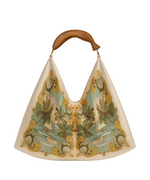 The Farm Rio Satin Scarf Mini Bag stands out with its cream hue, wooden handle, and playful botanical and bird print in green, gold, and beige.
