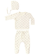 The Quincy Mae Baby Girls’ Take Home Set, shown here in a soft cream waffle fabric with a delicate small bow pattern, features three pieces: a bonnet, a long-sleeve wrap top, and drawstring waist pants. Each piece is laid out flat on a white background—making it the perfect cozy first outfit or take home set for newborns.