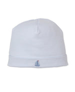Light blue, striped Pima cotton baby hat by Kissy Kissy, featuring a small hand-embroidered sailboat on the front cuff. Shown against a white background. Part of the CLB Summer Medley Striped Hat collection.