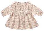 The Quincy Mae Baby Girls’ and Girls’ Ruffle Collar Button Dress, featuring long sleeves, a floral pattern, wooden buttons down the front, a ruffle collar, and a gathered waist, is displayed flat against a white background.