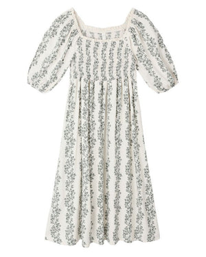 The Girls' Della Dress by Rylee & Cru is a white, ankle-length dress with puffed sleeves, a gathered bodice, vertical green floral print, and delicate crochet trim.