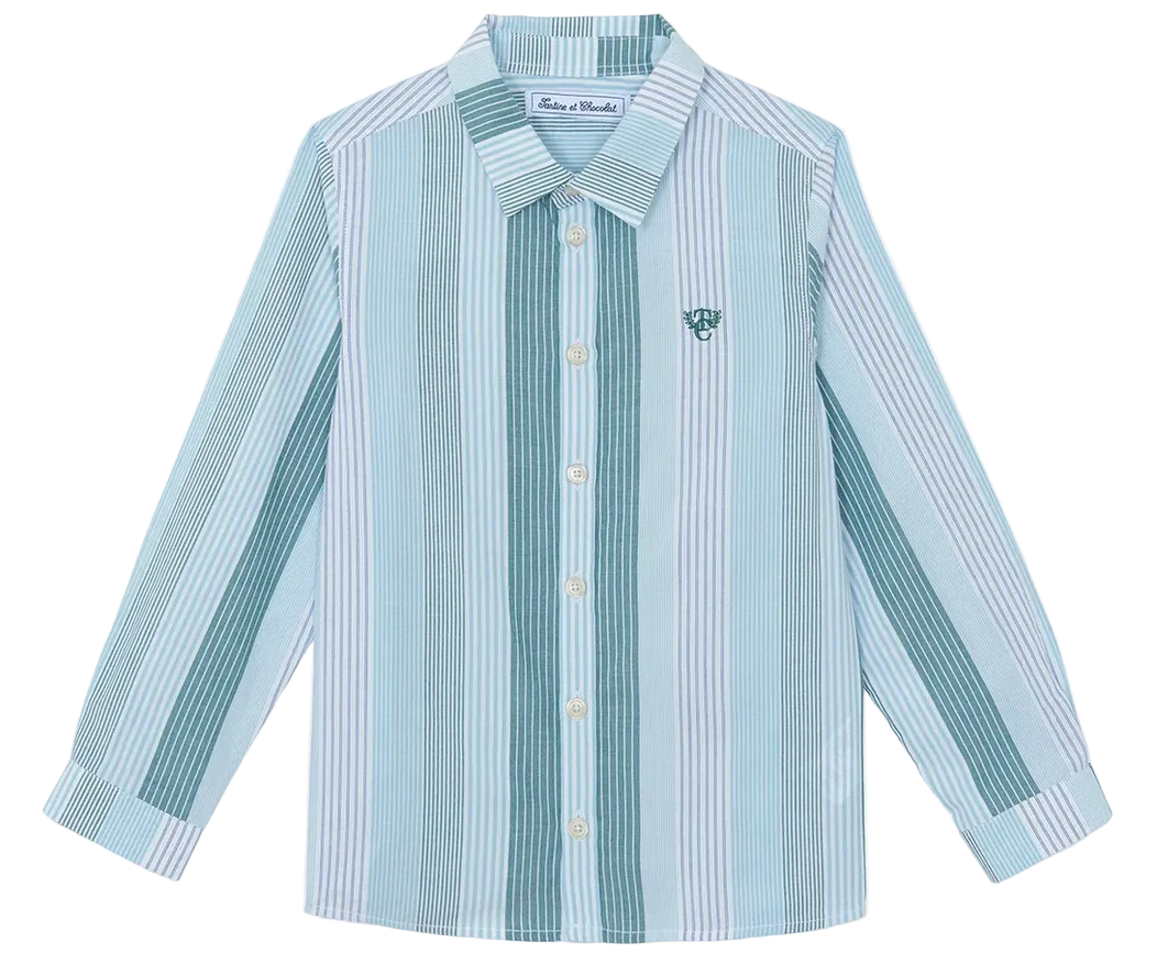 The Boys’ Badge Stripe Shirt from Tartine et Chocolat features vertical light blue and white stripes, a classic collar, and a subtle embroidered logo on the chest—crafted from soft cotton for comfortable, casual style.