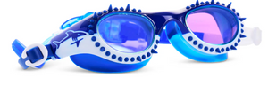 The Bling2O Kids' Shark Surge Goggles feature blue and white frames with purple-tinted lenses, shark graphics on the sides, and decorative spikes around the edges.