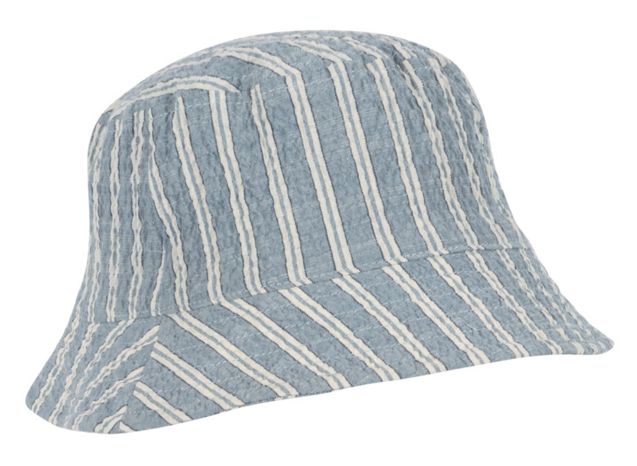 The Kids’ Elliot Bucket Hat by Konges Slojd features blue organic cotton fabric with white diagonal and vertical stripes, offering a textured finish ideal for enhancing your child’s summer wardrobe. Shown here against a plain background.