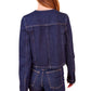 A person with long brown hair is shown from the back, wearing the Ulla Johnson Sabine Jacket, a dark denim piece with a vintage-inspired wash and jeans, showcasing a fitted silhouette.