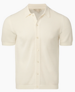 The Onia Crochet Knit Button Up is a cream short-sleeve shirt made from crochet cotton yarn, featuring a collar and button-up front—ideal for layering in warm weather. Shown against a plain white background.