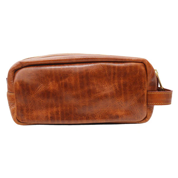 The Smathers & Branson Toiletry Bag, a rectangular brown Italian leather accessory hand-stitched with exquisite needlepoint detailing and designed with a side handle and zipper closure, is displayed from the front against a white background.